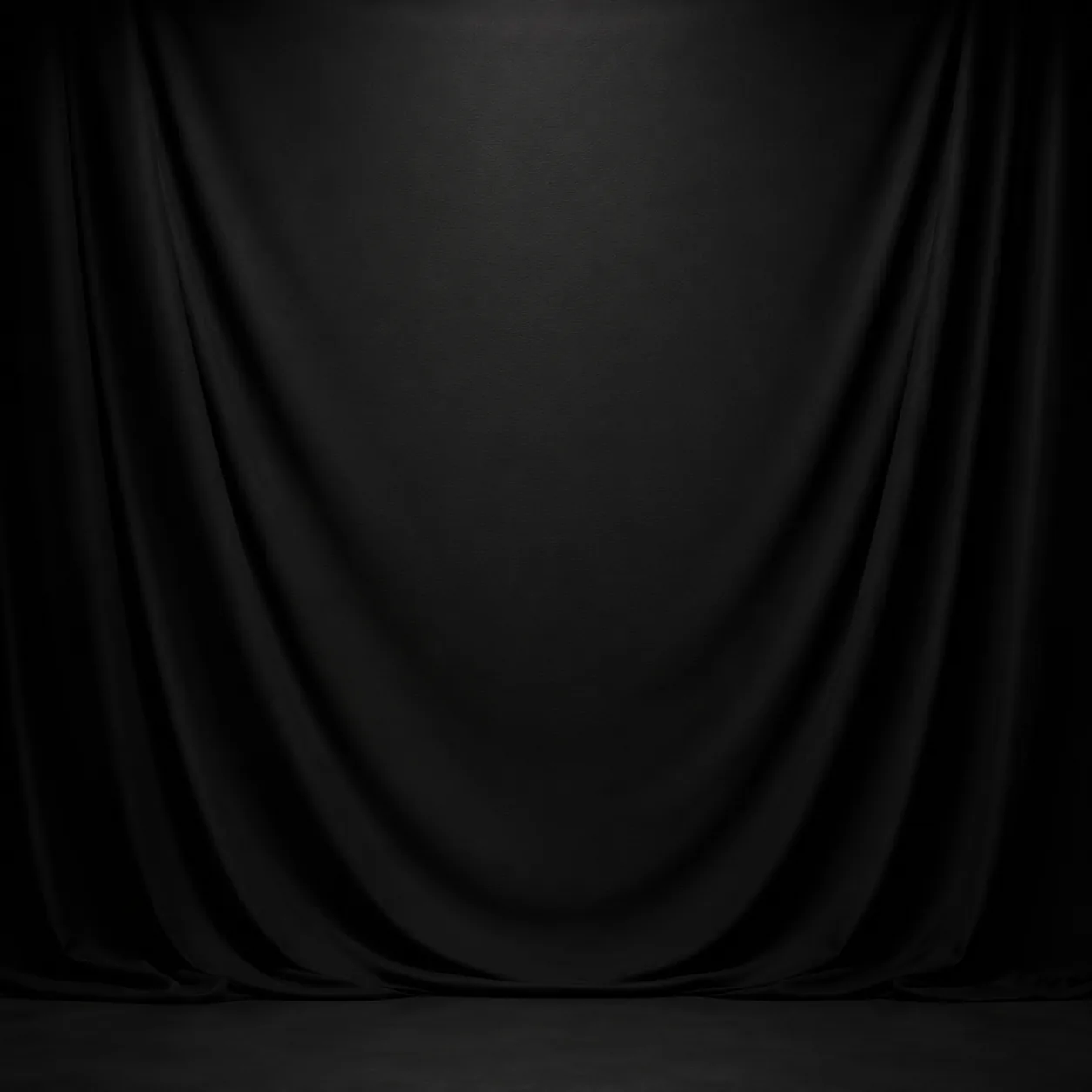 Pure black matte livestream backdrop fabric hanging in a studio